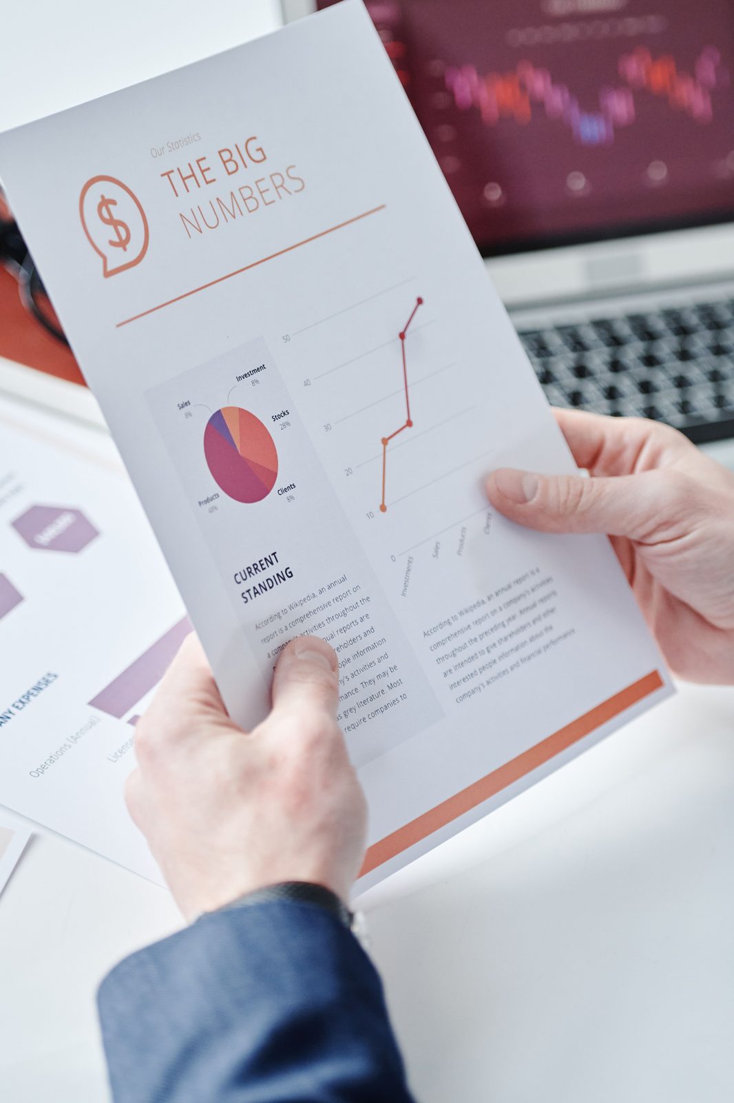 Printed report showing financial charts and figures